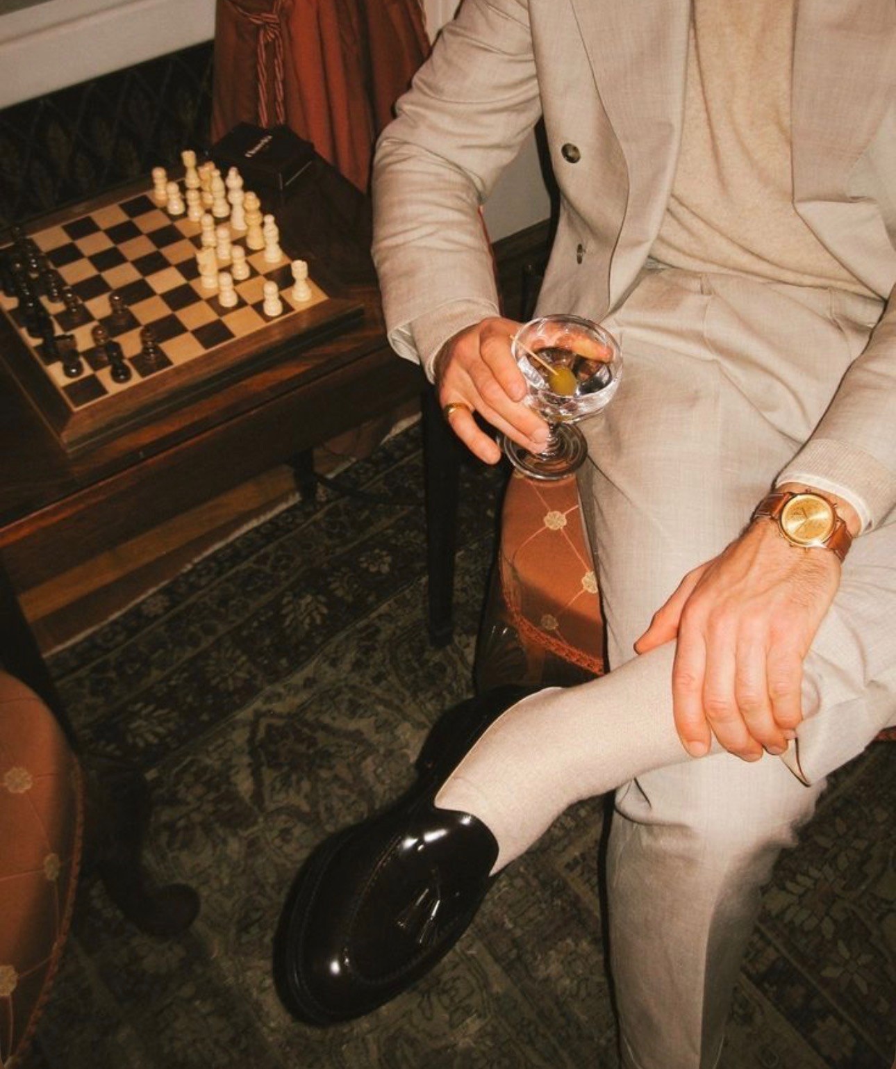 A guest receiving a vintage shoe shine during cocktail hour